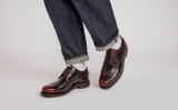 Sid | Mens Brogues in Burgundy Hi Shine Leather | Grenson - Lifestyle View