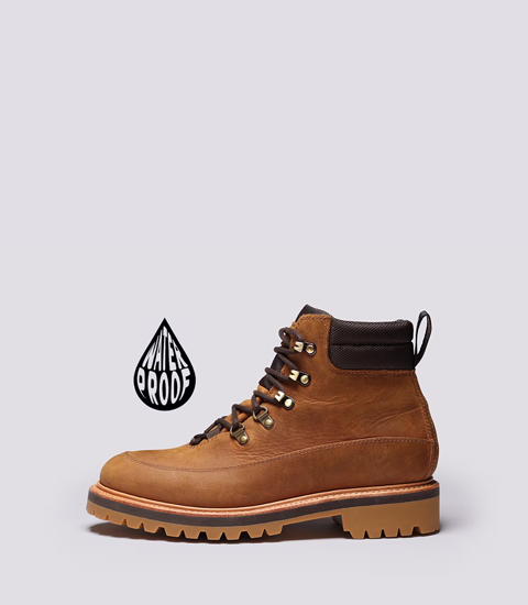 Brown waterproof hiking boot with laces and rugged sole.